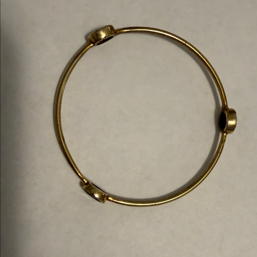 Woman’s brass bangle bracelet w/3 deep red stones. Very good.